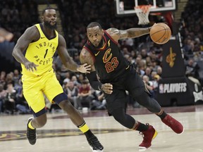 In this April 29, 2018, file photo, Cleveland Cavaliers' LeBron James, right, drives against Indiana Pacers' Lance Stephenson in the first half of Game 7 of an NBA basketball first-round playoff series, Sunday, April 29, 2018, in Cleveland.