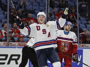 In this Jan. 5, 2018 file photo, United States forward Brady Tkachuk (7) celebrates a goal during the second period in the bronze medal game of the world junior hockey championships against the Czech Republic in Buffalo, N.Y.  Former NHL star Keith Tkachuk already has one son, Matthew, following in his footsteps. Soon, there could be a second. Brady Tkachuk, 18, is considered the top U.S-born draft prospect after his freshman season at Boston University.
