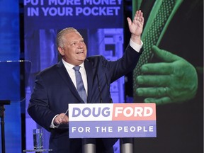 Ontario PC leader Doug Ford looks up while giving a tribute to his late brother Rob as he reacts after winning the Ontario Provincial election to become the new premier in Toronto, on Thursday, June 7, 2018.