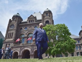 Ontario premier-elect Doug Ford walks out onto the front lawn of the Ontario Legislature at Queen's Park in Toronto on Friday, June 8, 2018. THE CANADIAN PRESS/Frank Gunn