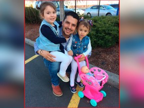 In this undated family photo provided by Sandra Chica, Pablo Villavicencio poses with his two daughters, Luciana, left, and Antonia.