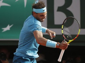 Spain's Rafael Nadal celebrates winning his semifinal match of the French Open tennis tournament against Argentina's Juan Martin del Potro in three sets 6-4, 6-1, 6-2, at the Roland Garros stadium in Paris, France, Friday, June 8, 2018.