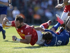 Canada's Luke Campbell (8) scores a try against Russia during the first half of play at Twin Elm Rugby Park on Saturday.