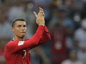 Portugal's Cristiano Ronaldo applauds after the group B match between Portugal and Spain at the 2018 soccer World Cup in the Fisht Stadium in Sochi, Russia, Friday, June 15, 2018.