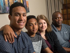 Serron Noel, a possible first-round pick in this year's NHL draft in Dallas, poses for a photo in his family's Barrhaven home with brother Kalen, mother Dara Lloyd and father Dean Noel. Wayne Cuddington/Postmedia