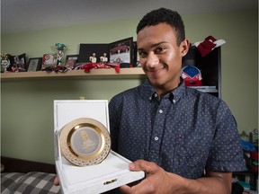 Serron Noel shows off the player of the game award he won with Canada's team during the world under-18 championship in Russia in April. Wayne Cuddington/Postmedia
