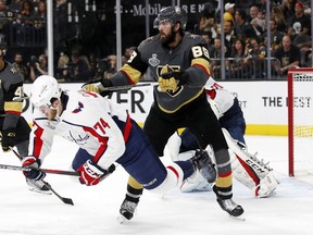 Vegas winger Alex Tuch, right, shoves Washington defenceman John Carlson during the second period of Game 2 of the Stanley Cup final on Wednesday night.