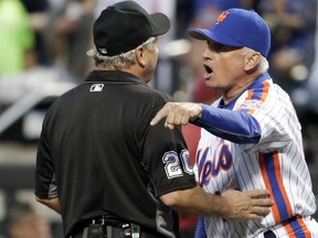 In this May 28, 2016, file photo, New York Mets manager Terry Collins (10) argues with umpire Tom Hallion after being ejected during the third inning of a baseball game against the Los Angeles Dodgers in New York. (AP Photo/Frank Franklin II, File)