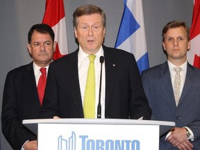 Toronto Mayor John Tory, flanked by Councillor Joe Cressy (right) and Councillor James Pasternak, ask for help as needs of refugees and asylum claimants overwhelm shelter system on Tuesday, June 26, 2018. (Antonella Artuso/Toronto Sun)