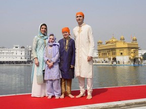 Prime Minister Justin Trudeau, right, wife Sophie Gregoire Trudeau, and children, Xavier, 10, Ella-Grace, 9, visit the Golden Temple in Amritsar, India on Feb. 21, 2018.
