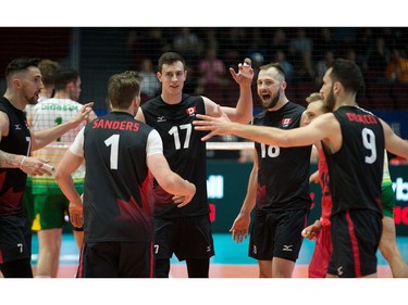 Celebrating a point for Canada in Friday's match against Australia are, left to right, Stephen Timothy Maar, Tyler Sanders, Graham Vigrass, Bradley Robert Gunter and Jason Derocco. Wayne Cuddington/Postmedia