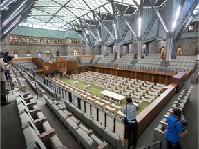The new House of Commons featurEs a vaulted glass ceiling and exposure to the historical building. Wayne Cuddington/Postmedia