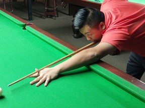 Ottawa's Howard Wong, a concert pianist, won the Orange Monkey Snooker League winter championship in his fourth year of competitive play. (MARTIN CLEARY/Postmedia Network)