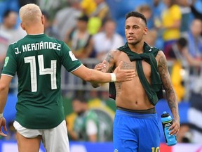 Brazil's Neymar greets Mexico's Javier Hernandez at the end of Monday's game. (GETTY IMAGES)