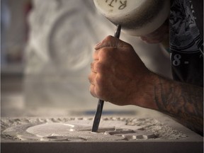 Matthew Greenough was taking part in the 2018 Canadian Stone Carving Festival on Sparks Street on Saturday.   Ashley Fraser/Postmedia