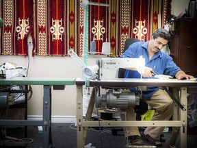 Wael Aun, a Syrian refugee who is one of the first to open his own business, a furniture upholstery business.