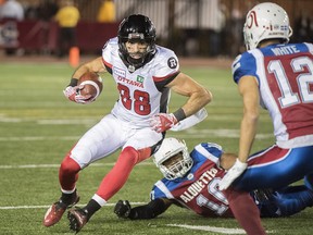Ottawa Redblacks' Brad Sinopoli cuts through the Montreal Alouettes defence during Friday's game. (THE CANADIAN PRESS)