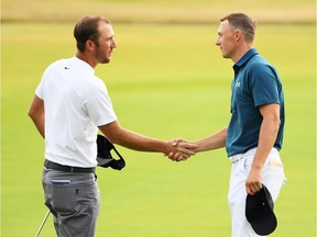 Jordan Spieth, right, removes his cap before shaking hands with playing partner Kevin Chappell after they completed third-round play in the Open Championship at Carnoustie on Saturday.