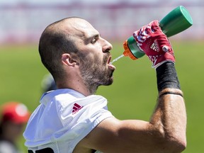 Ottawa Redblacks wide receiver Brad Sinopoli takes a drink during a break in team practice on a very hot summer day in the capital. July 3, 2018.