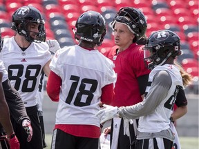 Quarterback Trevor Harris (second from right) and his Redblacks teammates practised at TD Place on Monday July 16, 2018.