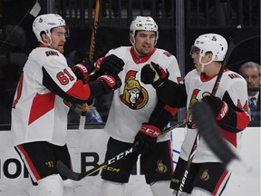 Mark Stone (61) and Cody Ceci, middle, celebrate a Senators goal with Jean-Gabriel Pageau (44) in a March 2 game against the Golden Knights in Las Vegas.