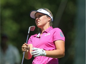 Brooke Henderson of Smiths Falls follows the flight of her tee shot on the eighth hole of Friday's round.
