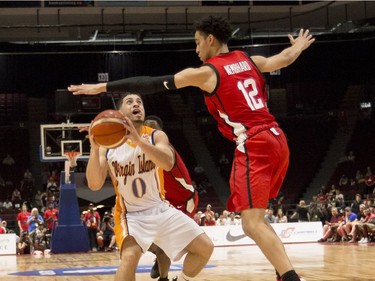 Canada's Andrew Nembhard (12) guards against U.S. Virgin Islands' Angel Rivera (0). Errol McGihon/Postmedia