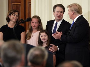 President Donald Trump greets Judge Brett Kavanaugh his Supreme Court nominee, in the East Room of the White House, Monday, July 9, 2018, in Washington. (AP Photo/Evan Vucci)