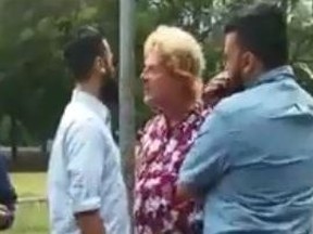 A blond man confronts a family at the Jack Layton Ferry Terminal in Toronto. (Facebook video screengrab)