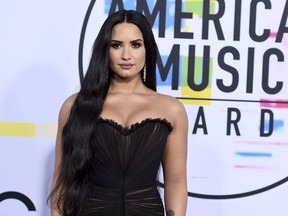 In this Nov. 19, 2017 file photo, Demi Lovato arrives at the American Music Awards in Los Angeles.