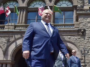 Ontario premier Doug Ford walks out onto the front lawn of the Ontario Legislature at Queen's Park.