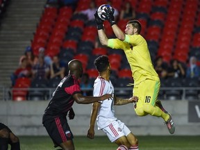 Goalkeeper Maxime Crépeau of Ottawa Fury FC leaps in the air to snag the ball during a United Soccer League match against Toronto FC II at TD Place Stadium in Ottawa, ON. Canada on May 31, 2018.