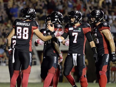 Redblacks slotback Brad Sinopoli (88) celebrates his second-half touchdown with quarterback Trevor Harris.