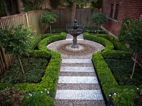 A Parisian-style garden, meant to be viewed from above, with a limited plant palette that features formal boxwood hedges framing a two-toned aggregate path that leads to an ornate water fountain and a bench that invites the homeowners to sit and contemplate their surroundings in peace and privacy.  (Photo courtesy of Plantenance, to illustrate Jennifer Cox's piece in the Gazette's New Homes & Condos section)