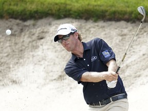 Canada's David Hearn hits out of a bunker on the eighth hole during the third round of play on Saturday at Silvis, Ill.