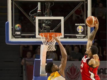 Canada's Khem Birch (24) goes up for a dunk against U.S. Virgin Islands' Justin Gray (8). Errol McGihon/Postmedia