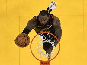LeBron James of the Cleveland Cavaliers goes up for a layup against the Golden State Warriors in Game 1 of the 2018 NBA Finals at ORACLE Arena on May 31, 2018 in Oakland, Calif.