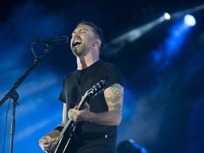 Lead singer Tim McIlrath from Chicago punk rock band Rise Against performs on the last night of RBC Bluesfest on Sunday.