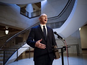 FILE - In a Nov. 2, 2017 file photo, Carter Page, a foreign policy adviser to Donald Trump's 2016 presidential campaign, speaks with reporters following a day of questions from the House Intelligence Committee, on Capitol Hill in Washington. President Donald Trump claimed Sunday, July 22, 2018, that newly released documents relating to the wiretapping of his onetime campaign adviser Carter Page "confirm with little doubt" that intelligence agencies misled the courts that approved the warrant. But lawmakers from both parties say the documents don't show wrongdoing.