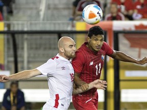 Jérémy Gagnon-Laparé (left) of Canada and Jorman Aguilar of Panama vie for the ball during a scoreless tie.