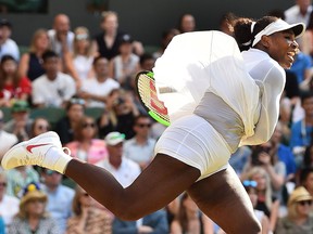 U.S. player Serena Williams serves to France's Kristina Mladenovic in their women's singles third round match on the fifth day of the 2018 Wimbledon Championships at The All England Lawn Tennis Club in Wimbledon, southwest London, on July 6, 2018.