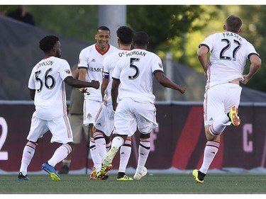 Toronto FC react to teammate Jonathan Osorio's, third from left, goal against the Ottawa Fury FC during first half Canadian Championship soccer action in Ottawa on Wednesday, July 18, 2018.