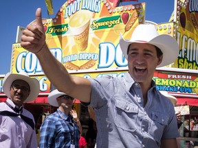 Prime Minister Justin Trudeau laughs it up at the Stampede in Calgary on Saturday, July 7, 2018.