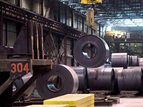 A coils of steel is moved by a crane at the Direct Strip Production Complex at Essar Steel Algoma in Sault Ste. Marie, Ont., on March 14, 2018.