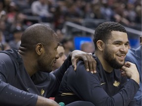 Fred VanVleet, right, gets a chuckle out of something Raptors teammate Serge Ibaka says on the bench during a game in Toronto on April 6. Stan Behal/Postmedia