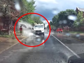 A white van appears to go out of its way to splash pedestrians in Ottawa.