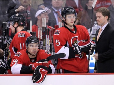 APRIL 20, 2010- Daniel Alfredsson leaves the bench while Chris Campoli, 14, Erik Karlsson, 65, and coach Cory Clouston have glum looks at the buzzer for the end of the third period as the Ottawa Senators meet the Pittsburgh Penguins at Scotiabank Place in game 4 of the Eastern Conference NHL playoffs.