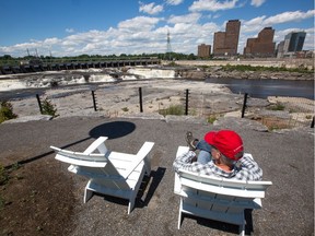 Following a visit to the Zibi site Postmedia reporter Blair Crawford admires the Chaudière Falls from the public viewing area.