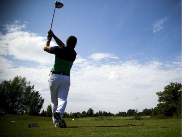Marc-André Cardinal follows through on a tee shot at The Marshes on Saturday.   Ashley Fraser/Postmedia