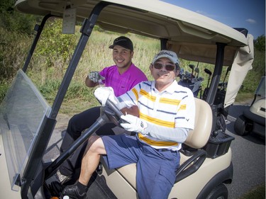 Jaeger Prot, left, and Bernie Ng finished second in the men's B Division of the Ottawa Sun Scramble following the final round at The Marshes on Saturday.    Ashley Fraser/Postmedia